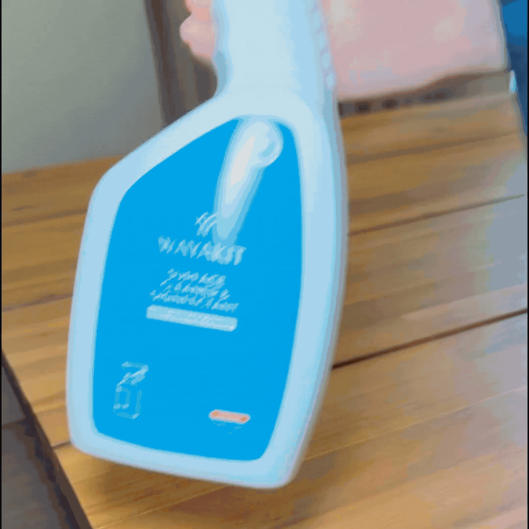 surface cleaner and disinfectant on table with microfiber cloth.gif
